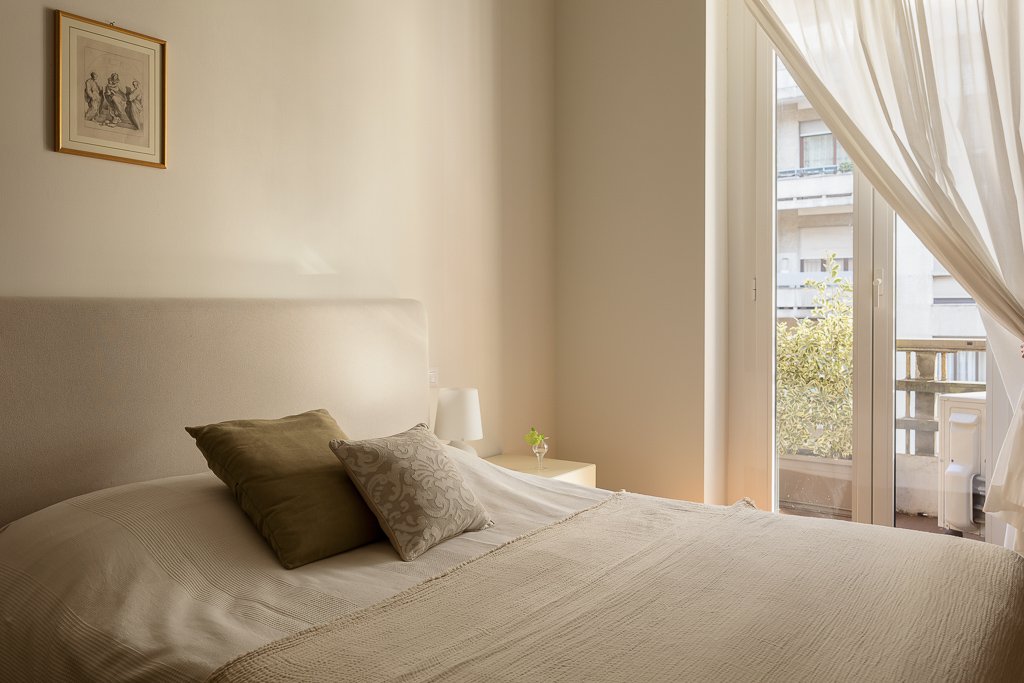 Bedroom 2 before bed reset — original messy bedding